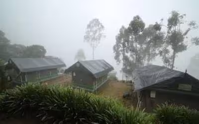 A tour to Munnar hills -African-style tent at Nature Zone Resort in Munnar, nestled amidst lush greenery and misty hills, offering a unique blend of luxury and nature.