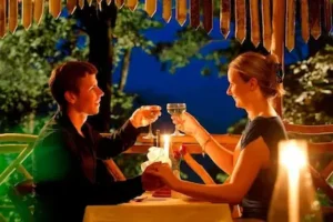 Romantic candlelight dinner setup for a honeymoon couple during one of our 7-day Kerala tour packages